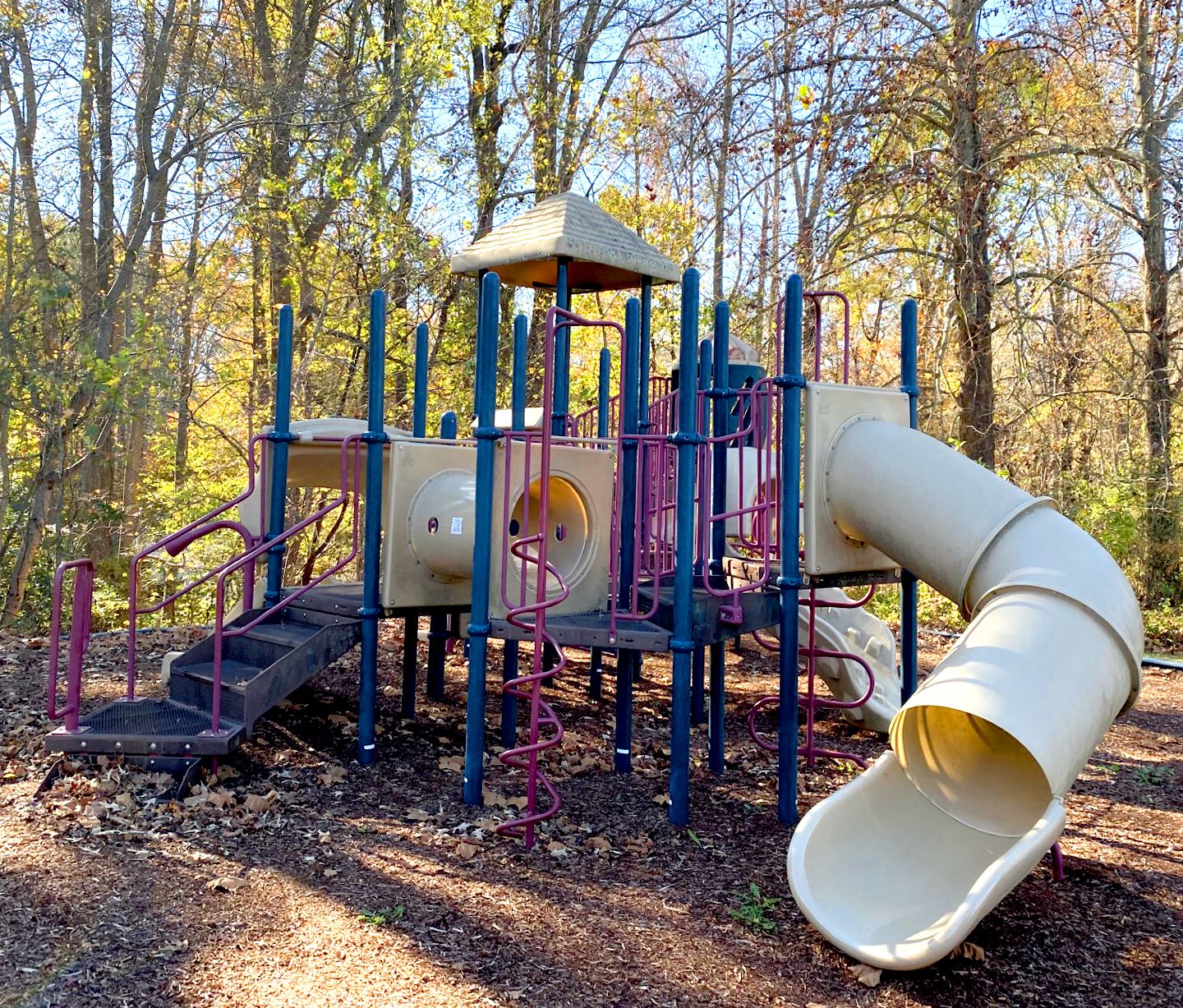 A play structure for young children with small slides
